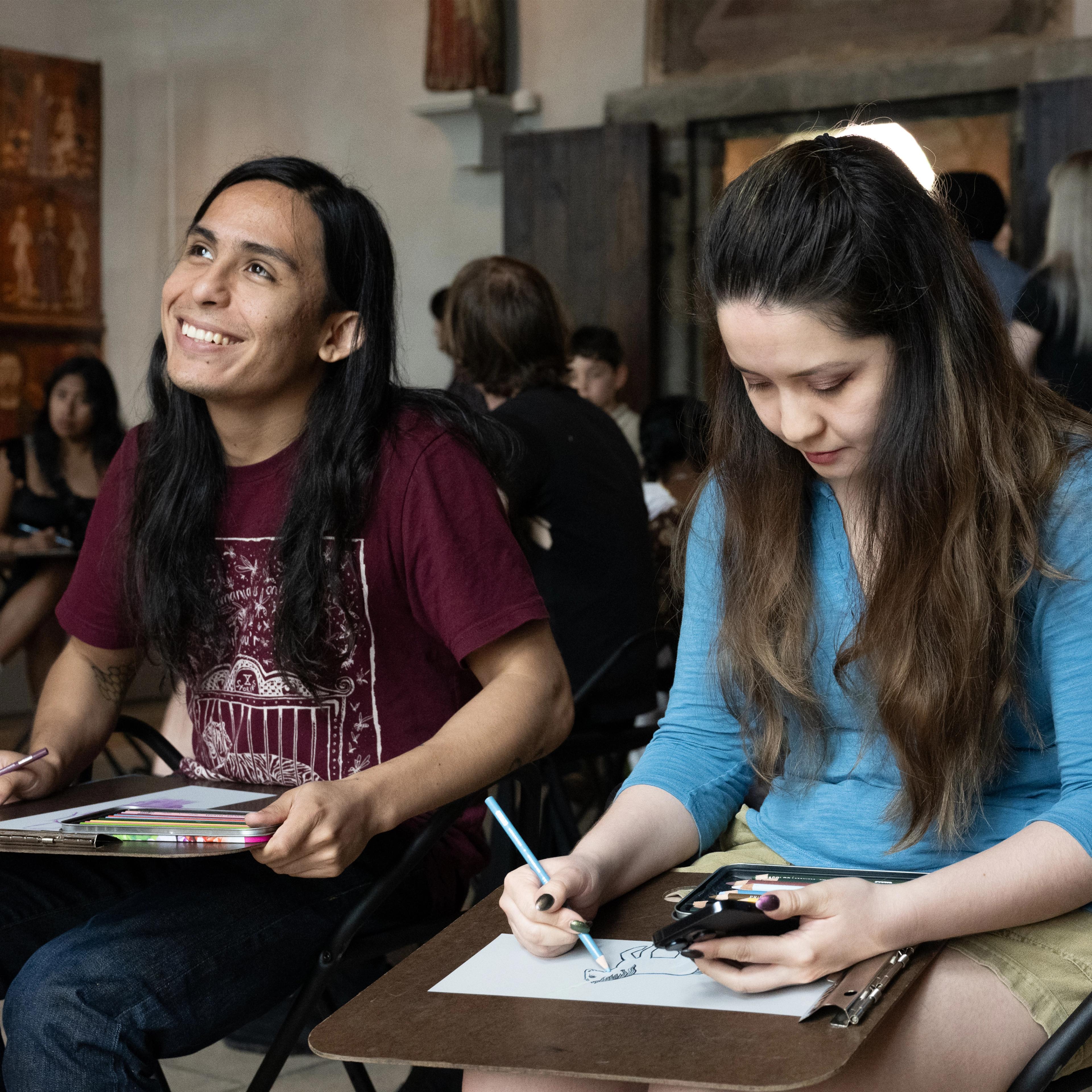 The Great Hall steps at the Metropolitan Museum of Art with two people walking up the stairs in the distance